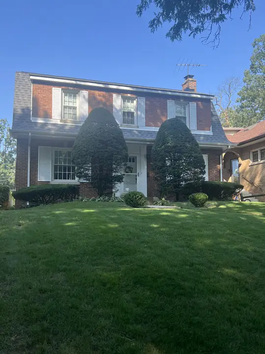 Brick Home With Sculpted Shrubs And Lawn Chicagoland