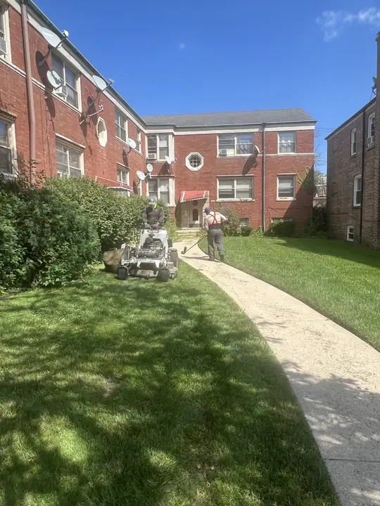 Crew Mowing Apartment Courtyard Lawn Chicagoland