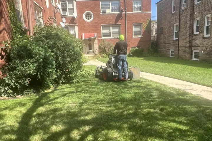 Crew Mowing Apartment Lawn Stand On Mower Posen Il