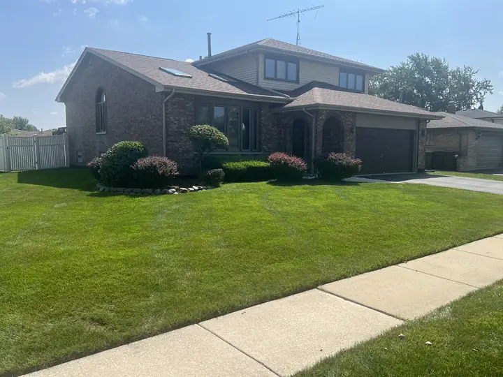 Maintained Lawn And Foundation Beds Brick Home Chicagoland